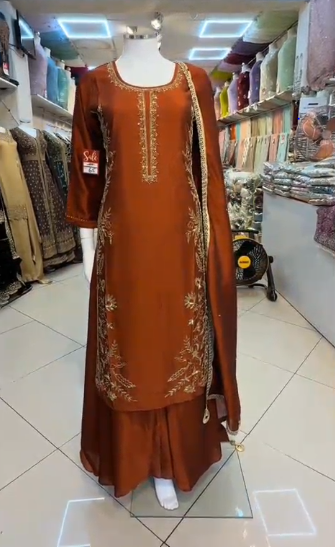 Rust brown embroidered sharara 3-piece with gold floral threadwork and chiffon dupatta – front view on mannequin