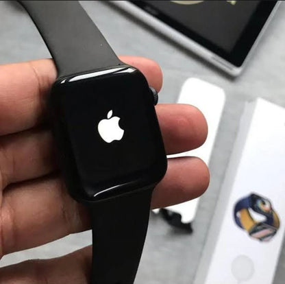 Series 9 smart watch black edition in hand showing Roman numeral luxury watch face on AMOLED display