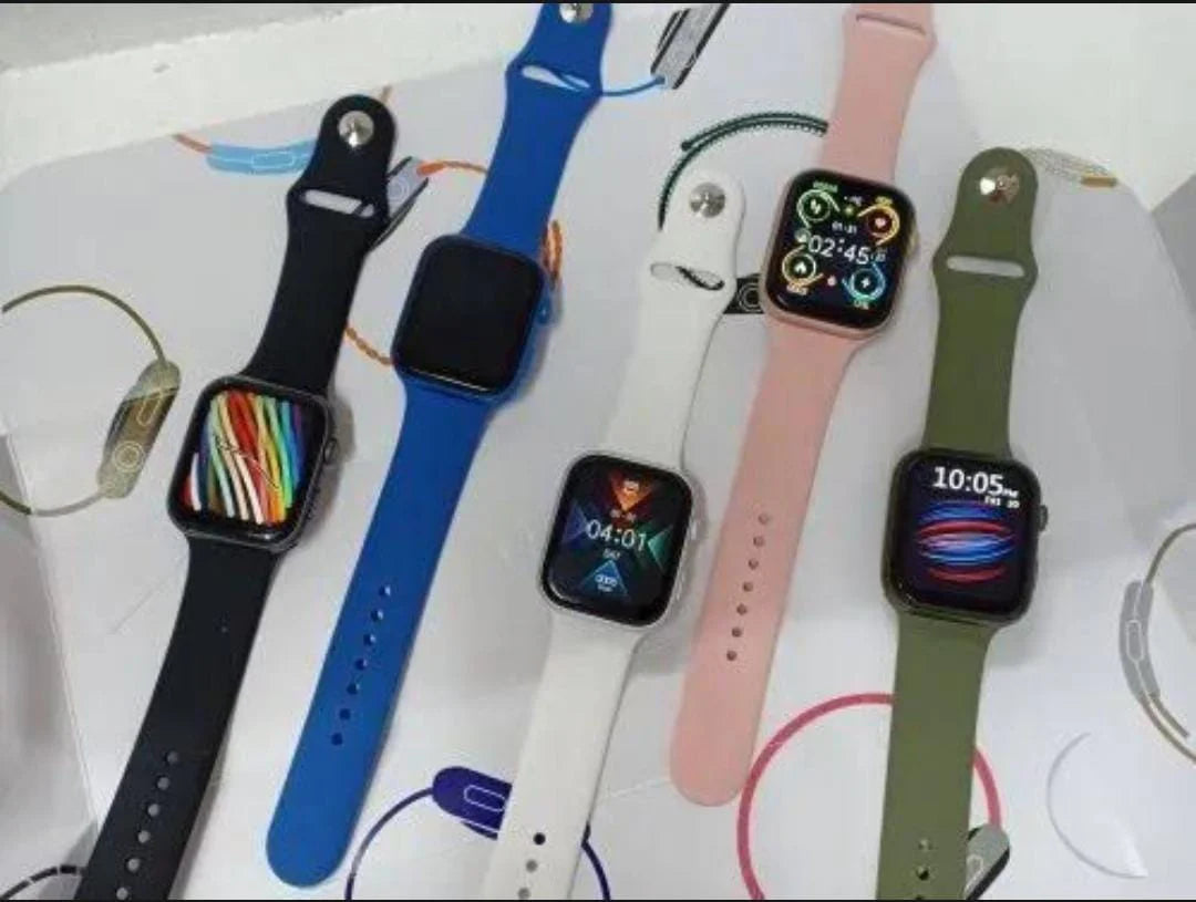 Series 9 smart watch black edition showing colorful app grid on AMOLED display – held in gloved hand