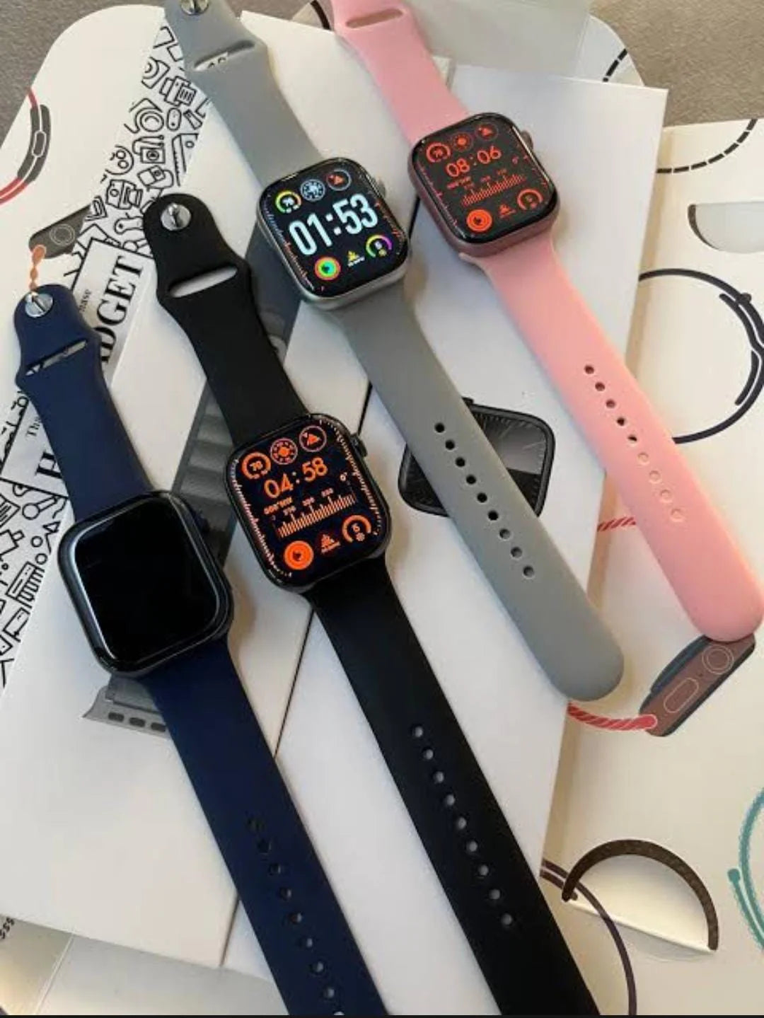 Series 9 smart watch black edition on white surface with box – showing always-on display and magnetic charging cable