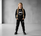Girl wearing Smile Kids Black Track Suit – Braids Front View