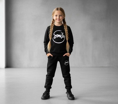 Girl wearing Smile Kids Black Track Suit – Braids Front View