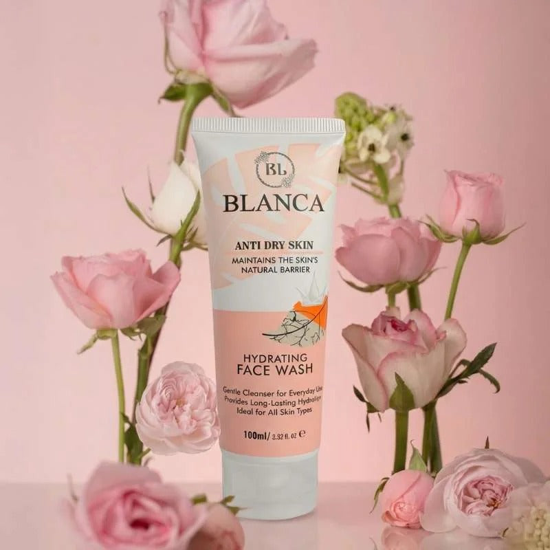 Blanca Anti Dry Skin Hydrating Face Wash 100ml with pink roses on pink background – premium lifestyle shot
