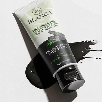 Blanca Pollution D-Toxx Face Wash with charcoal splash on white background dramatic product shot