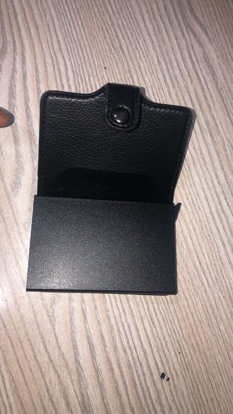 RFID card holder wallet open showing cards and cash - black and brown