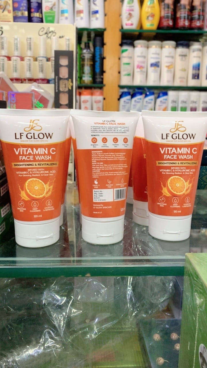 LF Glow Vitamin C Face Wash three tubes on glass shelf in store – front and back label visible