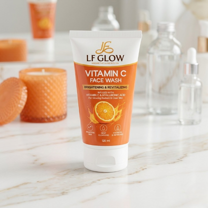 LF Glow Vitamin C Face Wash 120ml tube on marble counter with candles and serum bottles – bathroom lifestyle shot