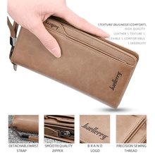 Baellerry Premium Long Leather Wallet in Black held in hands showing phone compartment with smartphone inserted – front product shot on white background