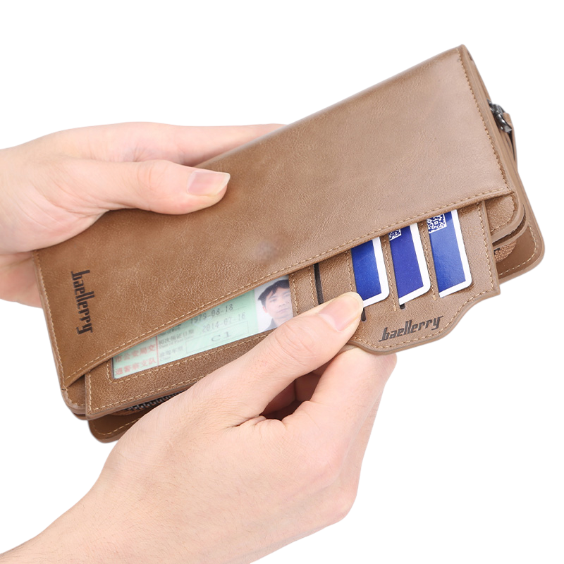 Baellerry Premium Long Leather Wallet in Black held in hands showing front exterior with gold zipper and wrist strap – product shot on white background