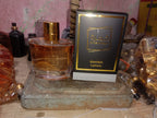 Khamrah Qahwa Black Edition Lattafa perfume bottle with black and gold box