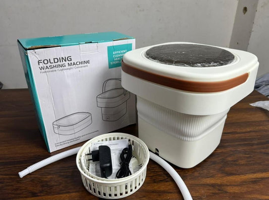 Foldable mini washing machine in mint green on marble countertop – suitable for small clothes