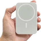 MagSafe power bank held in hand showing compact portable size
