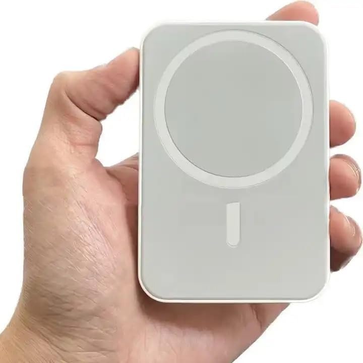 MagSafe power bank held in hand showing compact portable size