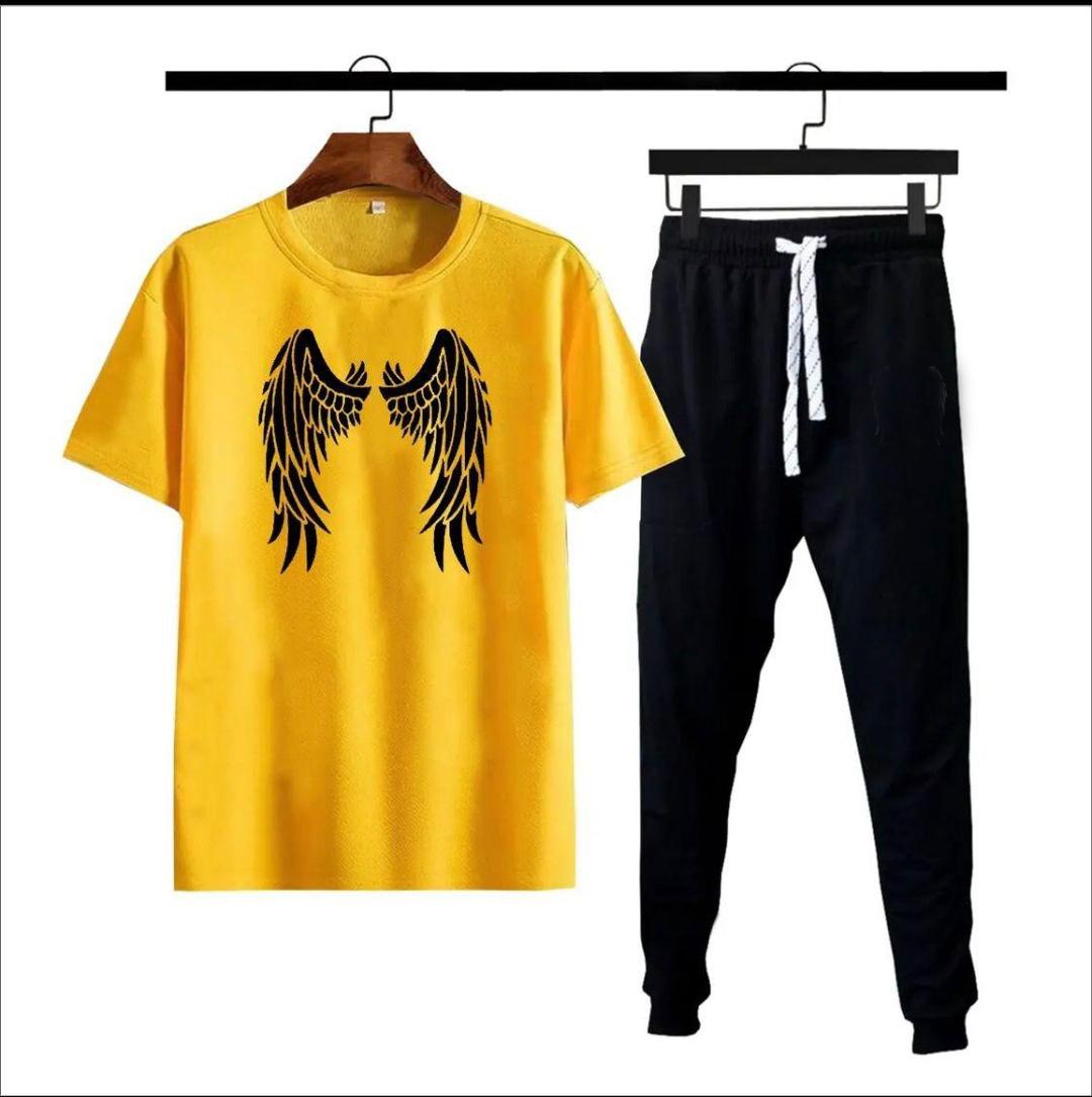 Green angel wings print t-shirt with black jogger tracksuit on hangers