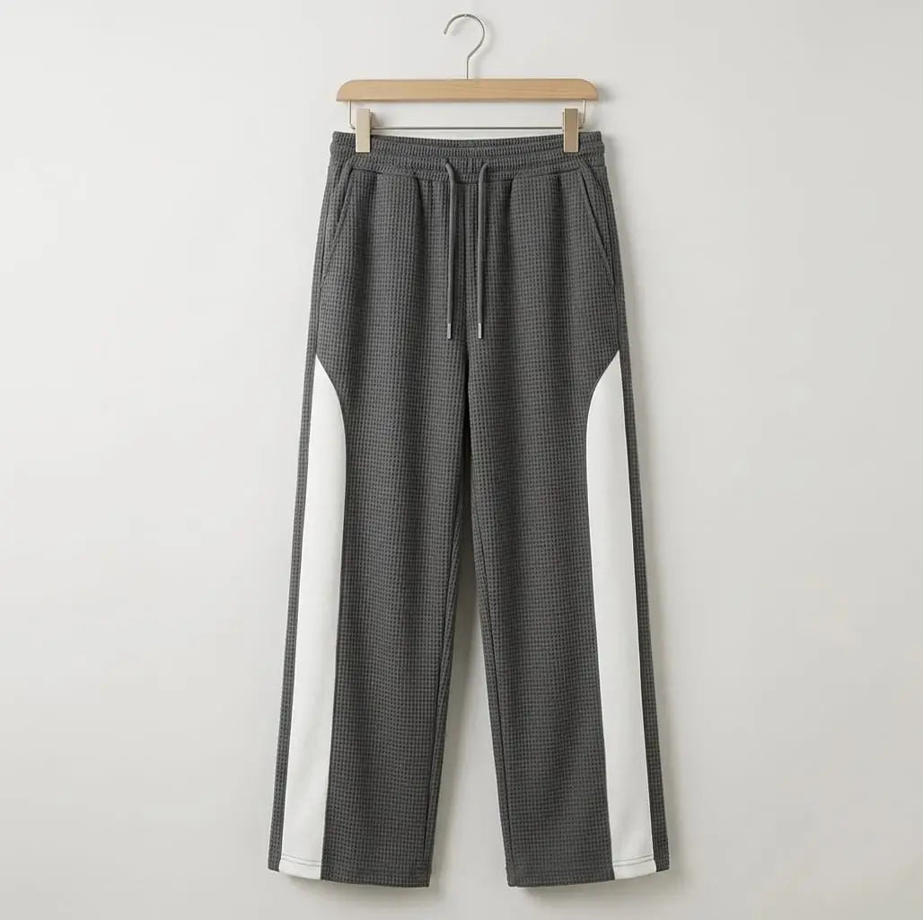 Grey waffle knit side stripe drawstring trousers on wooden hanger – full length product shot on white background