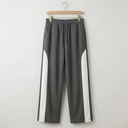 Grey waffle knit side stripe drawstring trousers on wooden hanger – full length product shot on white background