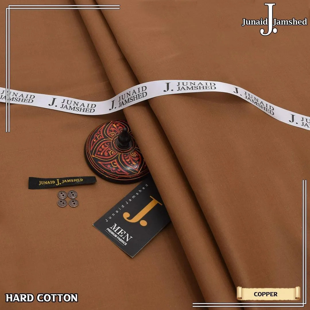 Junaid Jamshed Hard Cotton unstitched fabric in Brown color folded on leather journal with gold pins and J. Men brand tag