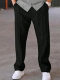 Man wearing black dri-fit plain drawstring trouser with grey t-shirt and white sneakers – close up front view on concrete background