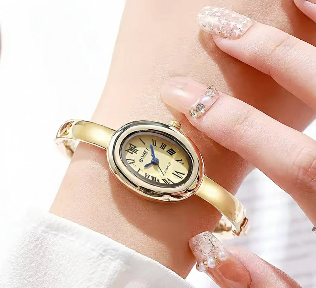 BOMEI gold bangle watch with diamond bezel on gift box