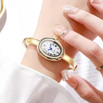 BOMEI gold bangle watch white dial on wrist