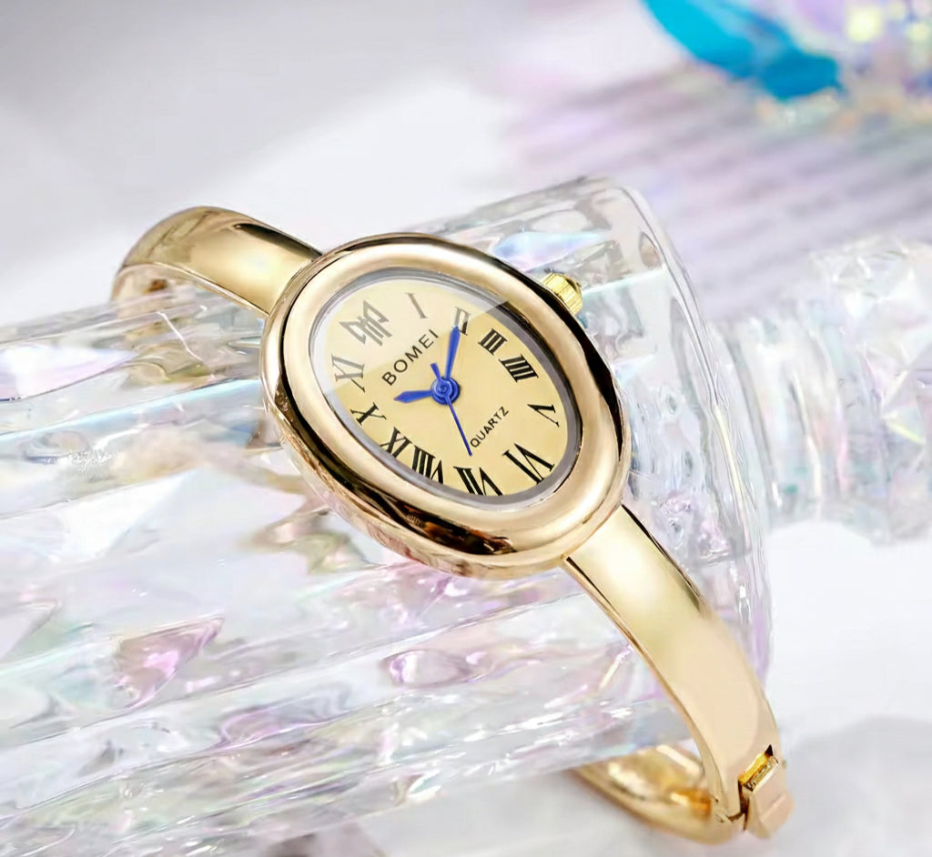 BOMEI gold bangle watch close up dial view
