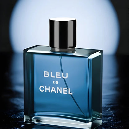 Bleu De Chanel blue glass bottle on dark reflective surface