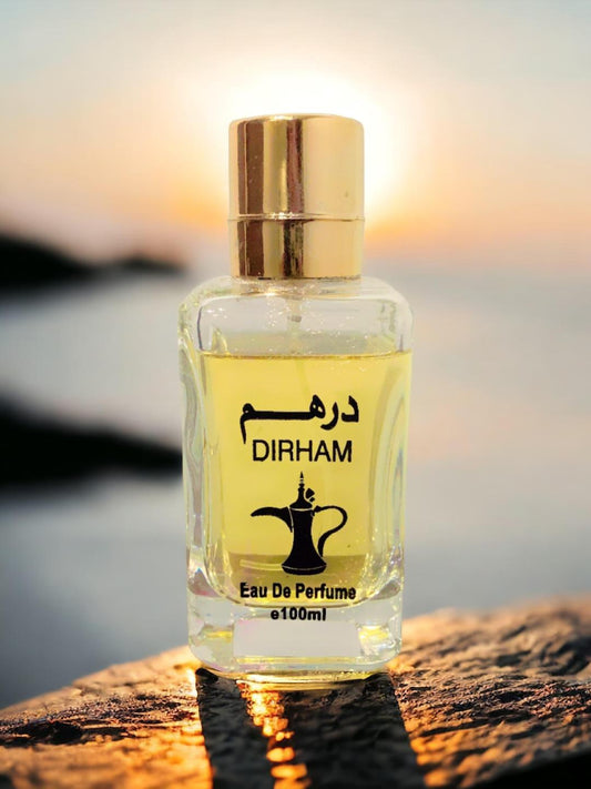 Dirham Perfume for Men 100ml bottle with golden cap at sunset