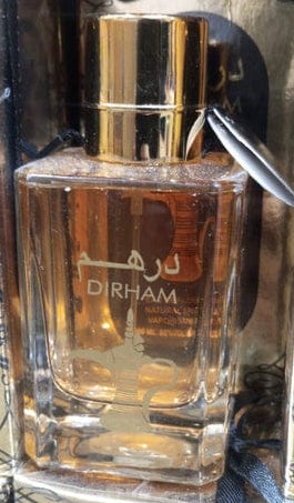 Dirham Perfume gold bottle close up view