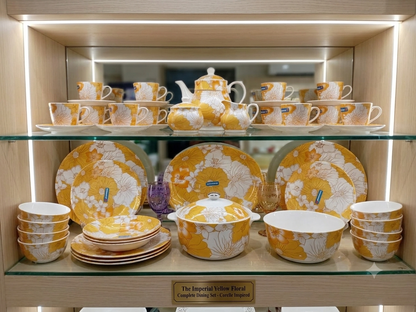 Imperial Yellow Floral dining set displayed on cabinet shelves