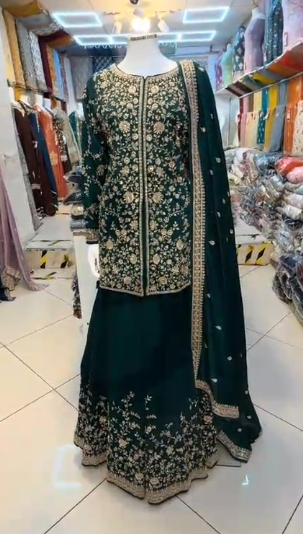 Dark green heavy embroidered sharara 3-piece with gold floral threadwork and dupatta – front view on mannequin