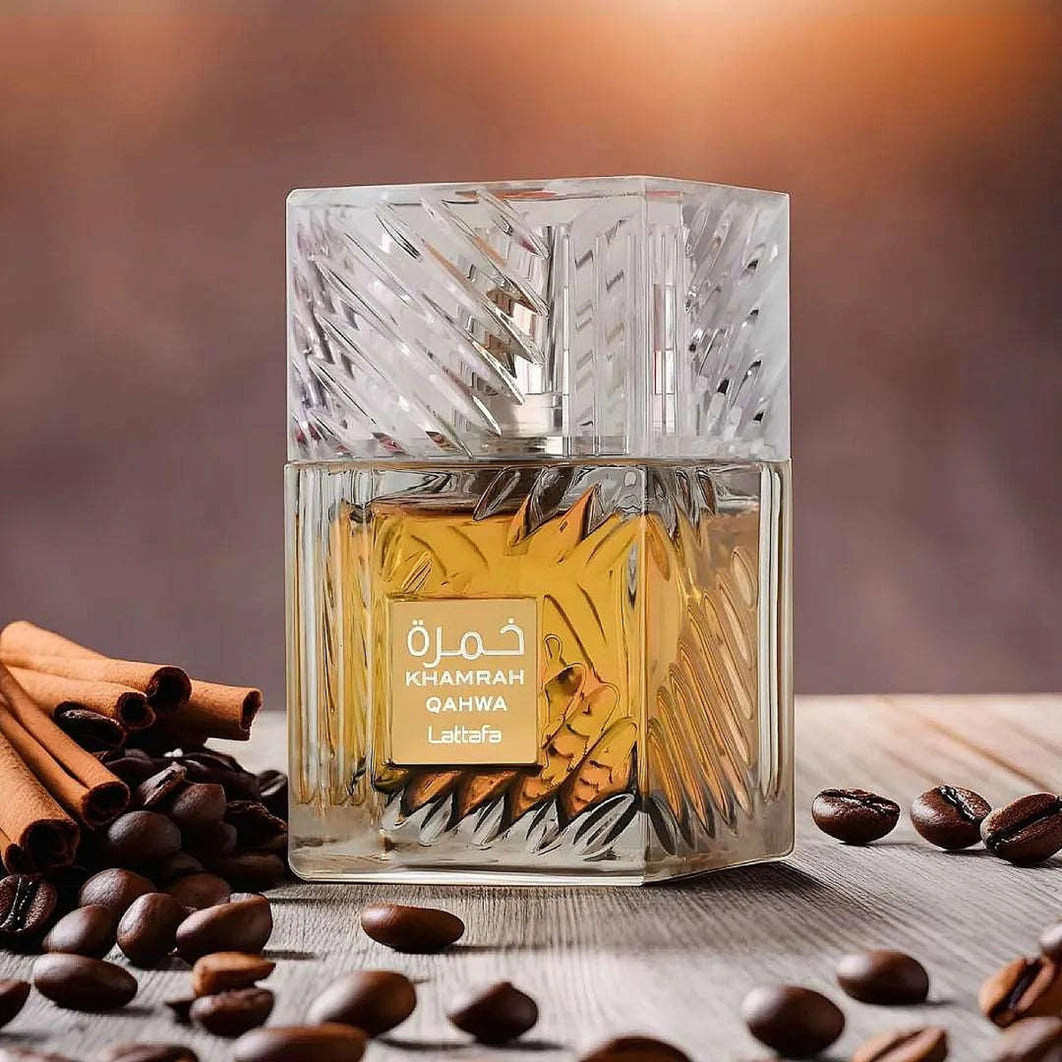 Khamrah Qahwa Lattafa Perfume with coffee beans and cinnamon sticks